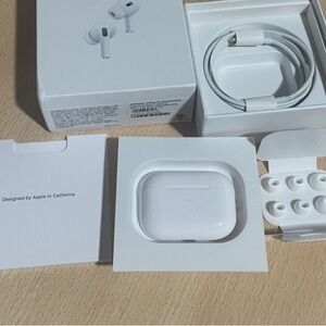Apple AirPods Pro with White Charging Case and Accessories